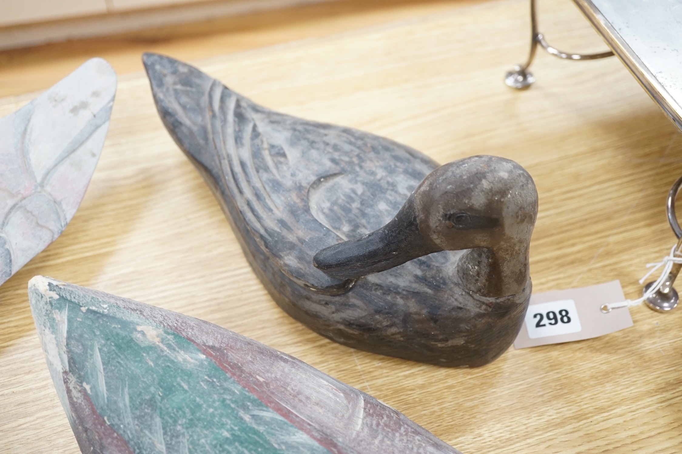 Five primitive wood decoy ducks, one in flight, longest 40cm